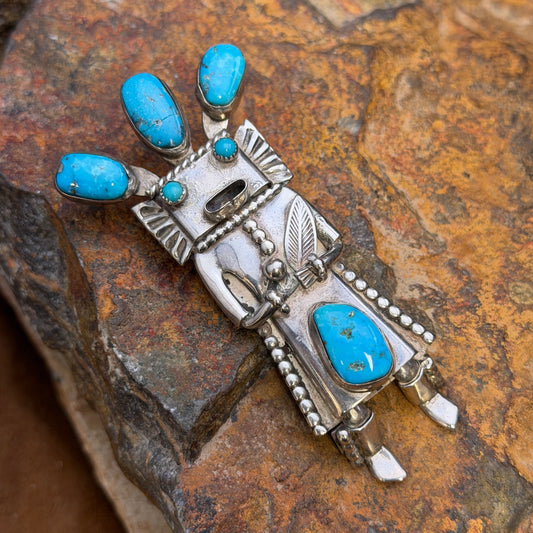 Full front view of kachina bolo slide and pendant with rich blue turquoise and crack in top center stone