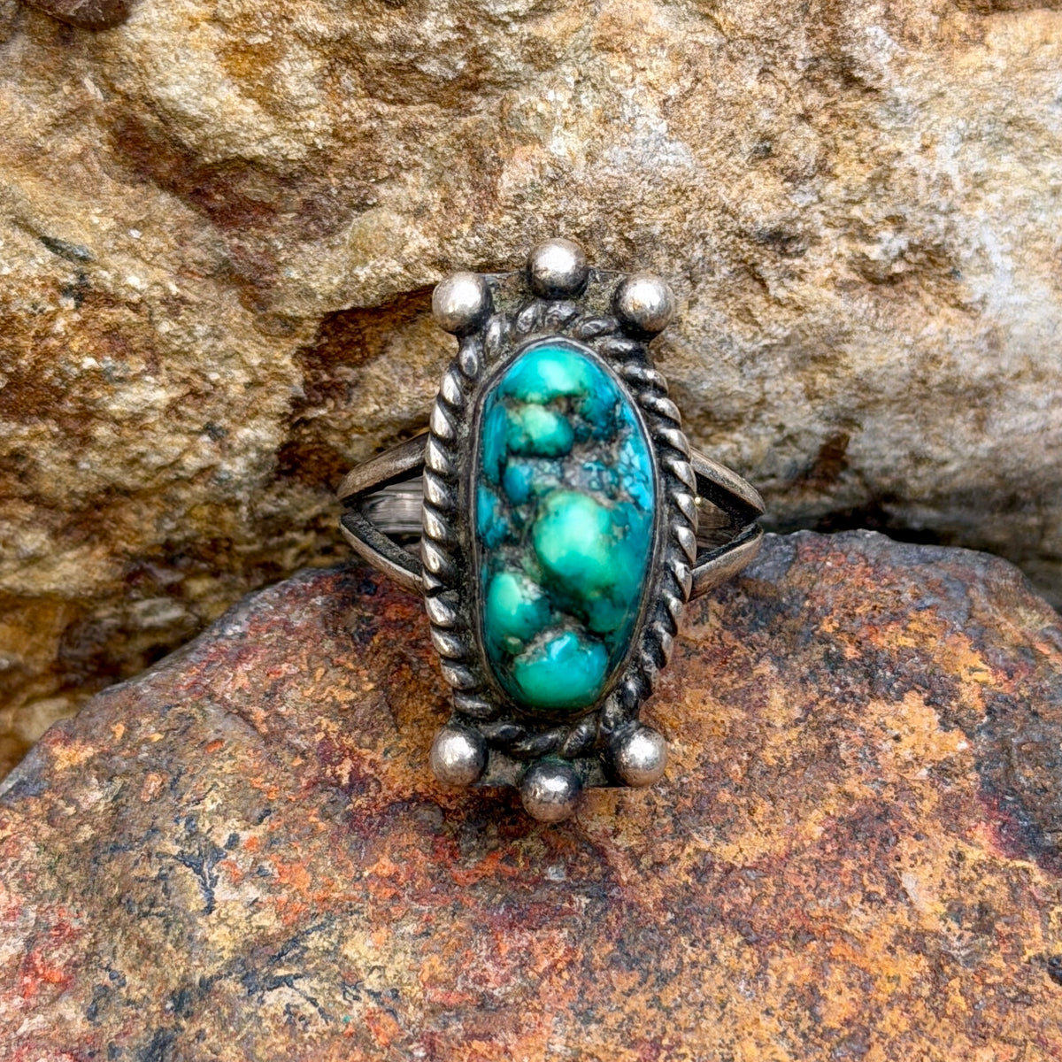 Back of vintage turquoise ring showing MB hallmark and split shank