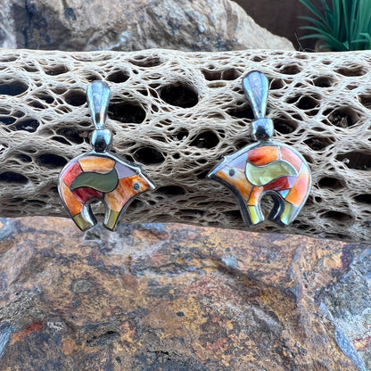 Post earrings that have bears that are inlaid with orange, white, and gold