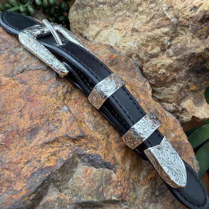 Decorative belt buckle with silver on a rocky surface