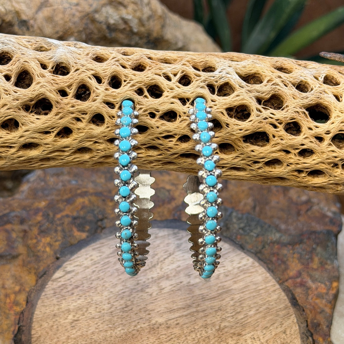 Sleeping Beauty turquoise hoop earrings by Marlon Quam, angled view