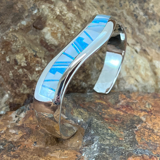 as part of the NEW Mystic Pearl collection, features Mother of Pearl and Lab Opal in a Fancy Inlay Pattern.